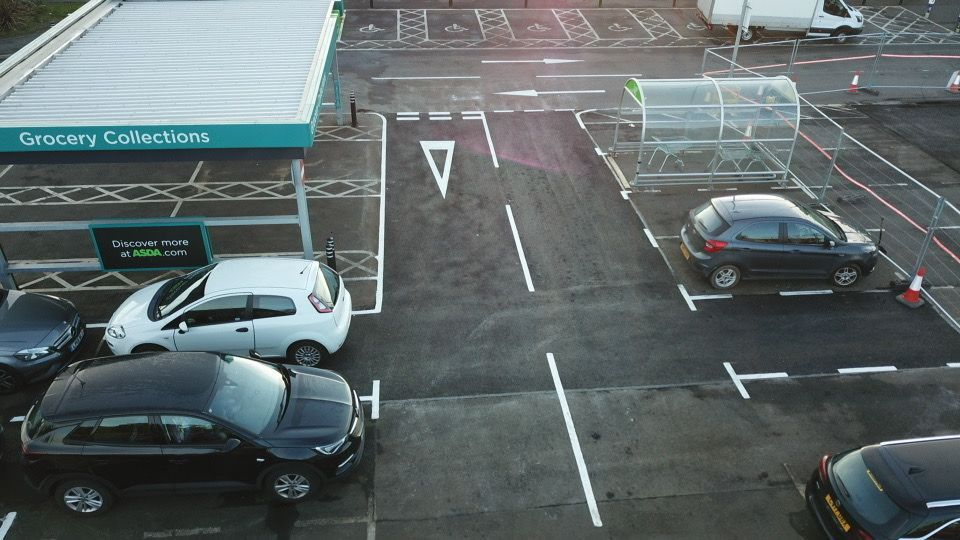 Grocery collection bays newly marked out beside the store entrance.